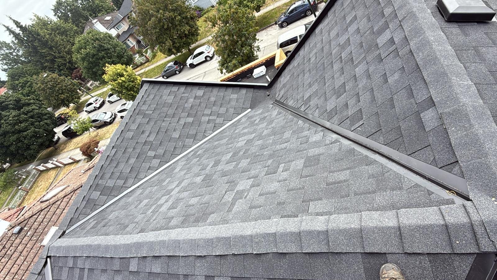Completed asphalt shingle roof on a Langley residence